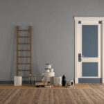 Room with wooden ladder and paint cans, after painting
