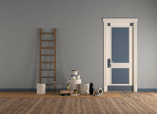 Room with wooden ladder and paint cans, after painting