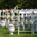 Beautiful wedding setting. View of a wedding venue with empty seats and flowers