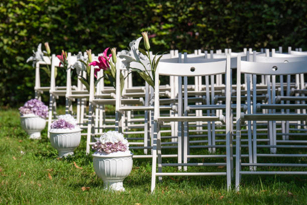 Beautiful wedding setting. View of a wedding venue with empty seats and flowers