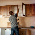 Carpenter working on new kitchen cabinets