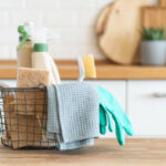 Modern kitchen interior in the background. House cleaning concept