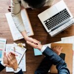 business-people-shaking-hands-together (1)